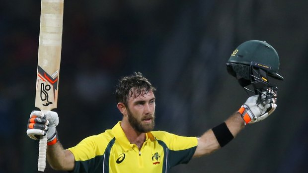 Australia's Glenn Maxwell celebrates scoring a century against Sri Lanka during their first Twenty20 cricket match in Pallekele.