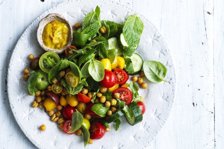 Chickpea and tomato salad with coconut dressing.