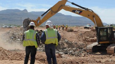 Big find: Workers monitor progress at the old Alamogordo landfill in search of buried Atari games.