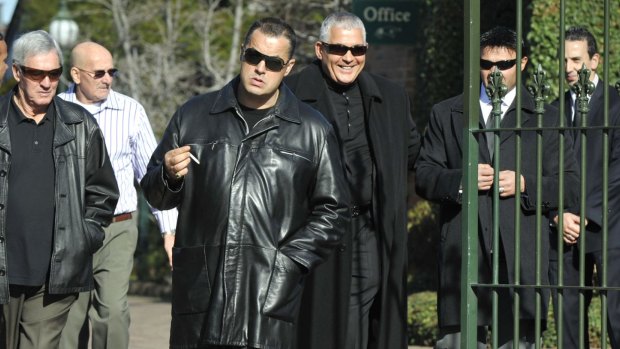 Matt Tomas (centre) and Mick Gatto (centre back) attend the funeral of Desmond "Tuppence" Moran in 2009. 