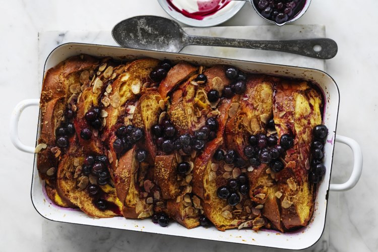 Baked French toast with almond and blueberry maple sauce.
