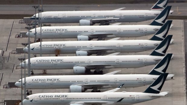 Cathay Pacific parked at Hong Kong Airport during the pandemic. Hong Kong will give away thousands of flights to help restart the city's tourism industry.