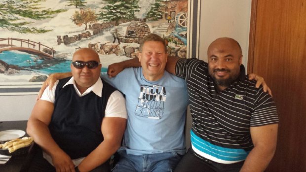 Muslim community members Beylal Racheha (left) and Adam Bowden (right) tracked down Craig Campbell (centre) after hearing that he hadn't been recognised for his bravery.