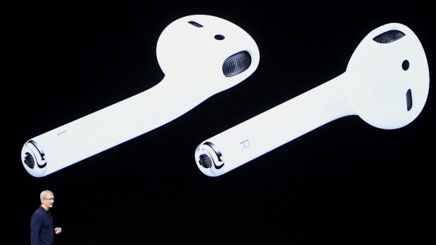Tim Cook shows off the wireless AirPods during the Apple event in San Francisco, California.