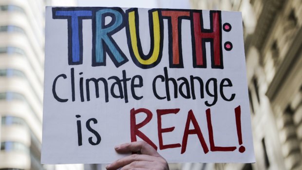 A demonstrator holds a sign during the "March For Truth" protest at Foley Square in New York on Saturday.
