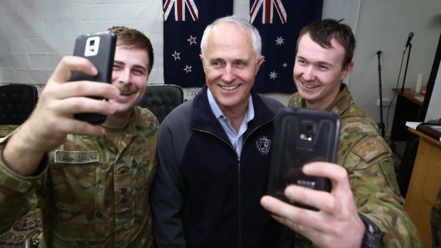 Prime Minister Malcolm Turnbull appears in selfies with Lieutenant Joshua Armstrong, 26, and Lance Corporal Lincoln Pade, 22, during his visit to Taji Military Complex in Iraq. 