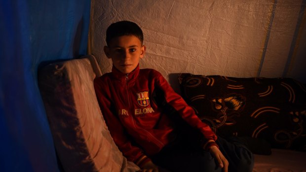 Hussein Hatem, 10, from Mosul. He lives in a tent with his family at Khazer Camp 1, home to 38,000  displaced Iraqis who have fled Mosul and surrounding villages.