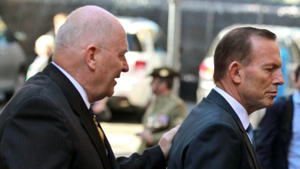 How it should have been: Governor-General Sir Peter Cosgrove showing former prime minister Tony Abbott the way out. 