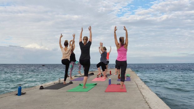 Oceanfront yoga is one of many activities you can enjoy in Timor-Leste.