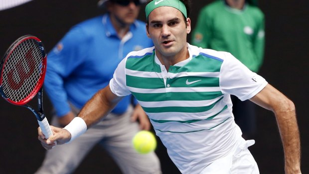 Roger Federer of Switzerland in action against Alexandr Dolgopolov of Ukraine.