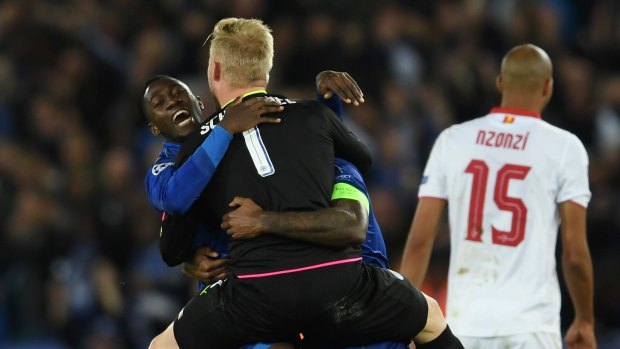 Wilfred Ndidi, Kasper Schmeichel and Wes Morgan celebrate Leicester's success.