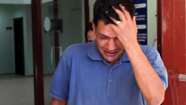 Abdullah Kurdi, 40, father of Syrian boys Aylan, 3, and Ghalib, 5, who were washed up drowned on a beach near Turkish resort of Bodrum on Wednesday, cries as he waits for the delivery of their bodies outside a morgue in Mugla, Turkey on Thursday.