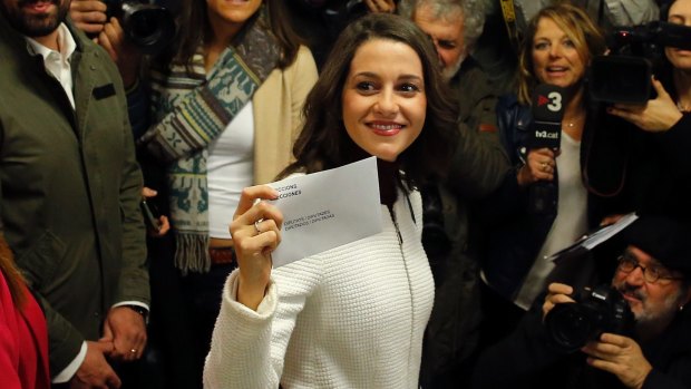 Ciutadans (Citizens) party leader Ines Arrimadas displays her ballot envelope before voting.