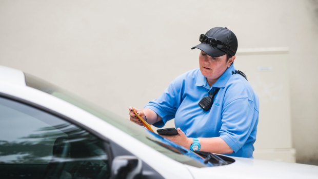 An ACT parking inspector leaves a ticket on the windscreen of a car in Civic in February. 


4 Feb 2015
Photo: Rohan Thomson
The Canberra Times