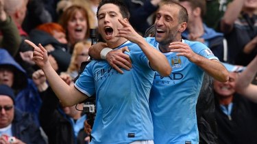 Samir Nasri (front) celebrates his goal in Manchester City's win over West Ham United last weekend which clinched the Premier League title for his side.