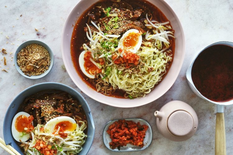 Ramyeon noodles with spicy broth, chilli beef, soft-boiled egg and kimchi.