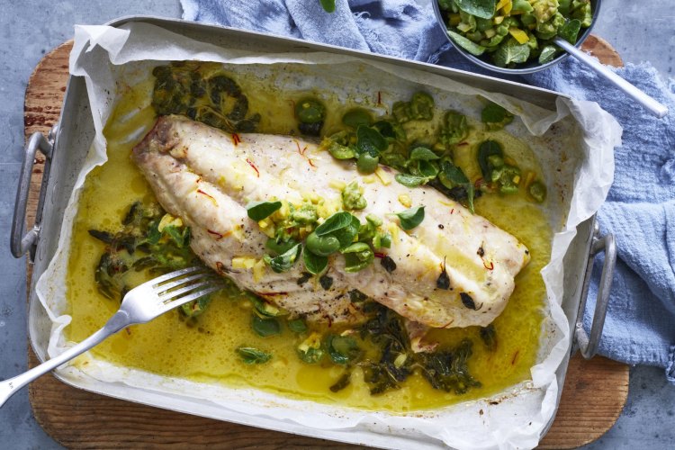 Baked fish with saffron butter, lemon and green olives.