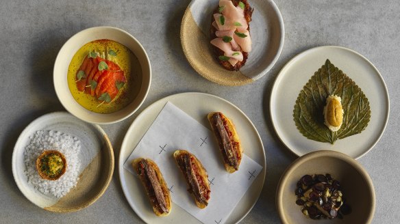 Mezze, clockwise from centre: Anchovy toast, potato and lentil tart with batarekh and leek, raw king salmon, hand-stretched haloumi, aged rice and sea urchin, and Pharaoh's foie gras.