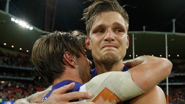 Clay Smith and Caleb Daniel embrace after the preliminary final.