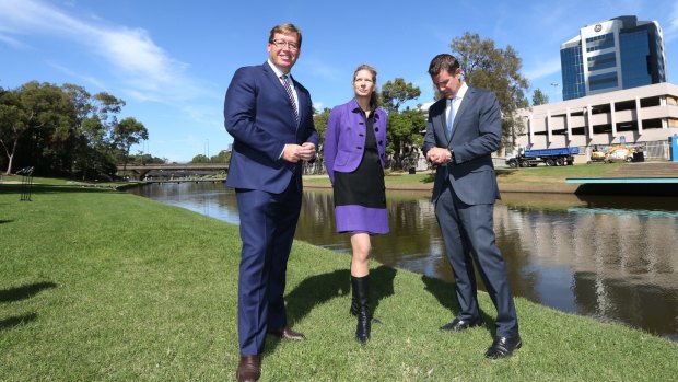 New home: Arts Minister Troy Grant, MAAS director Dolla Merrillees and NSW Premier Mike Baird opposite the proposed site in Parramatta for the Powerhouse Museum.