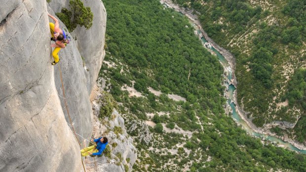 Rock climbers at Verdon Gorge, in the Alpes-de-Haute-Provence, France.