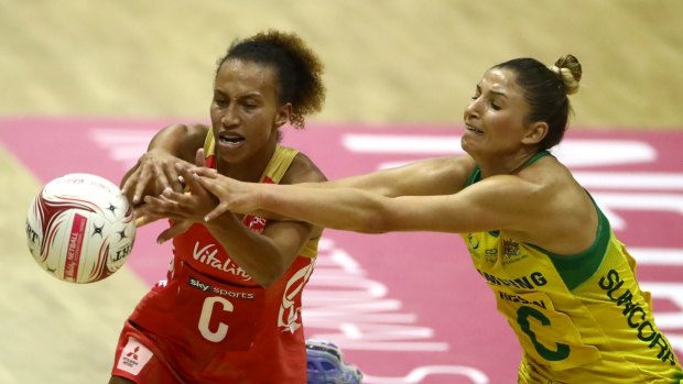 Arch-rivals: Australia's Kim Ravaillion battles England's Serena Guthrie in London.