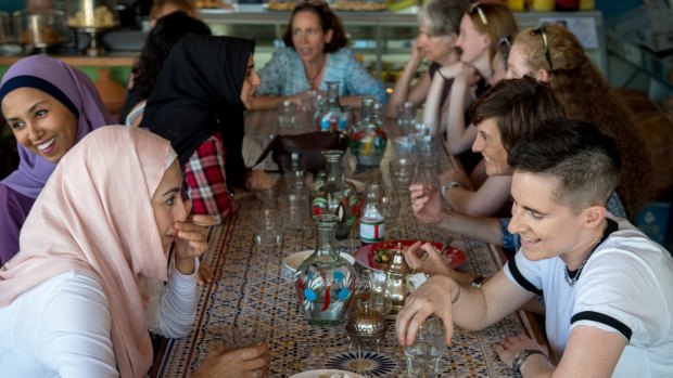 Aseel Tayah (left in pink) and Madelaine Imber (right) at the  Speed Date a Muslim event at the Moroccan Deli-Cacy in Lygon Street, East Brunswick. 