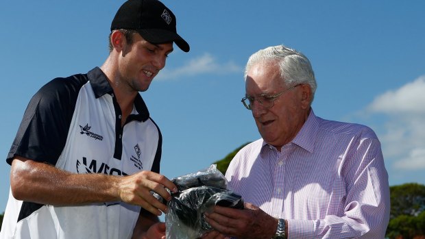 If the cap fits: Alan Davidson presents Mitchell Marsh with his Wests cap.