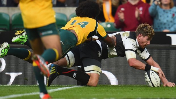 Queensland-bound flanker Adam Thomson scores in the corner for the Barbarians.