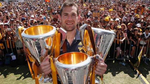  Luke Hodge with the 2013, 2014 and 2015 premiership trophies.