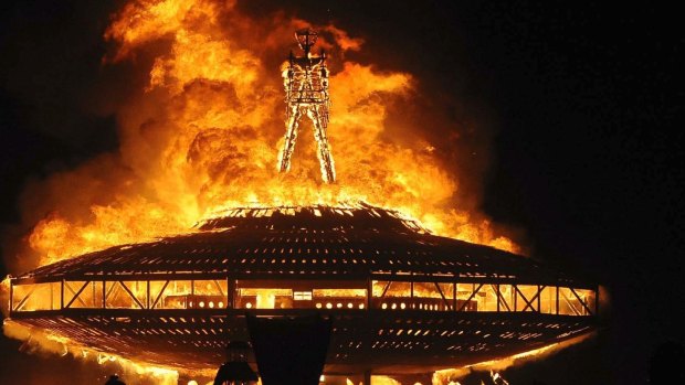 The "Man" burns on the Black Rock Desert at Burning Man in 2013.