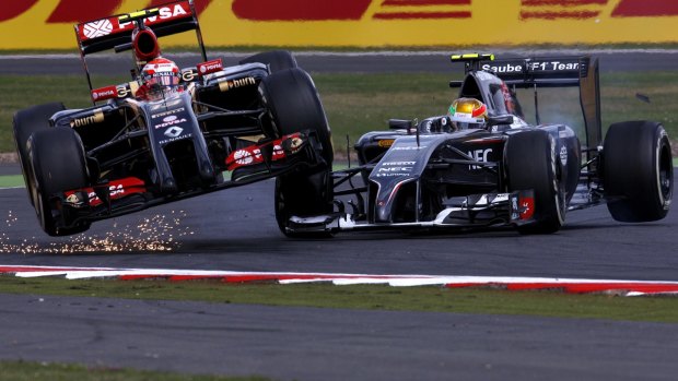 Crash magnet:  Maldonado collides with Esteban Gutierrez of Mexico and Sauber during the British  Grand Prix last year.
