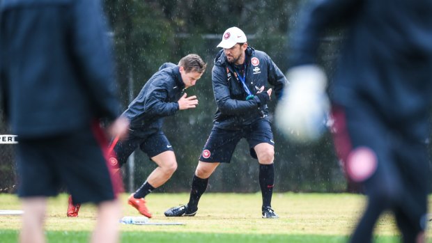 Back to work: Tony Popovic spurs on new recruit Scott Jamieson as Western Sydney start pre-season training.
