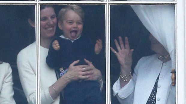 An excited Prince George watches the Queen's birthday parade from a window in the care of his nanny.