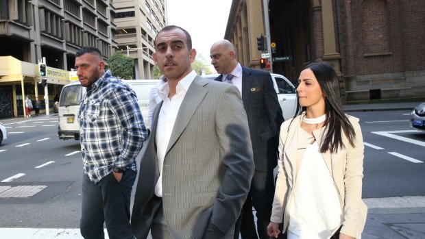 The accused murderer Mahmoud Barakat (second from left) leaves the NSW Supreme Court on Tuesday.