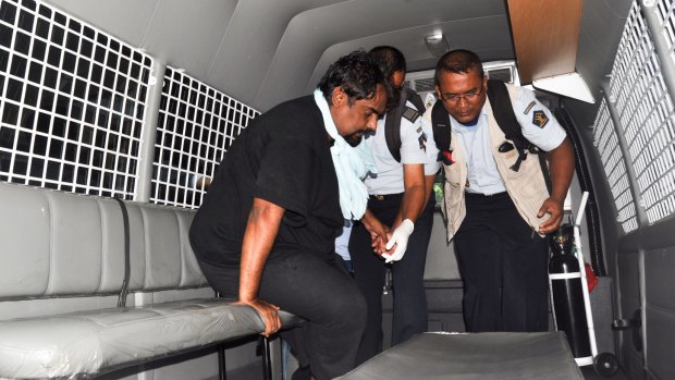 Pakistani death row prisoner Zulfiqar Ali (left) is transferred from hospital to the Indonesian penal island of Nusakambangan ahead of his execution by firing squad.  