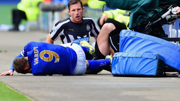 Sideline show: Mike Williamson of Newcastle United fouls Jamie Vardy of Leicester City.
