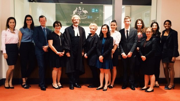 Barrister Alan Hands (centre) and Faye Gertner (left of Hands) the director of Monash Oakleigh Legal Service, with students who worked on the High Court application for murderer John Glascott.
