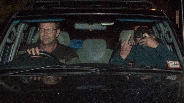 Mark Tromp (on right) eaves the Wangaratta police station with his brother.