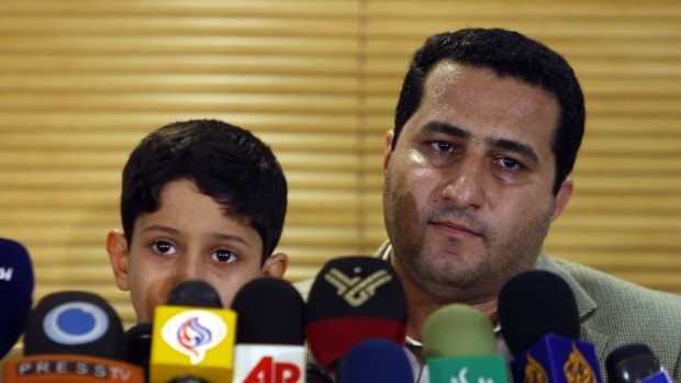 Shahram Amiri with his son Amir Hossein after his arrival at Imam Khomeini airport in July 2010.