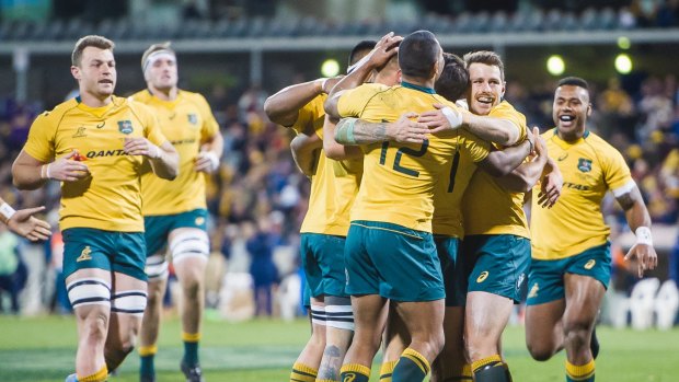 Success, at last: The Wallabies celebrate victory over the Pumas in Canberra.