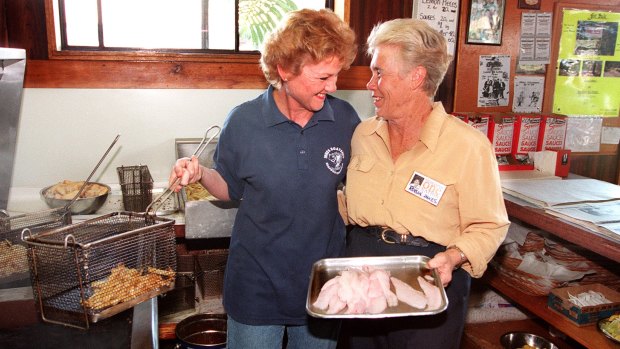 Pauline Hanson cooking up fish and chips with One Nation candidate Robin Innes.