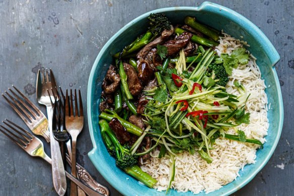 Sticky beef stir-fry with optional shredded green mango salad.