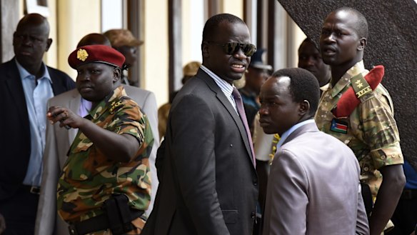 Angelo Kuot Garang (in sunglasses) at Juba airport awaiting the return of rebel leader and South Sudanese Vice-President Riek Machar.