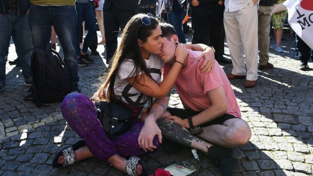 Members of the public gather in Albert Square, Manchester on Tuesday afternoon.