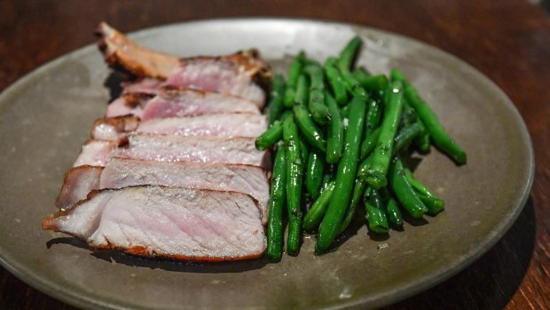 Go-to dish: Western Plains pork chop with crunchy green beans.