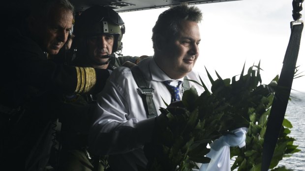 Greek Defence Minister Panos Kammenos drops a wreath in the sea off the islets of Imia, where three Greek servicemen died in 1996 during a confrontation with Turkey. 
