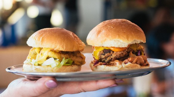 The Fisherman slider with calamari (left) and the Double Bacon Cheeseburger slider .