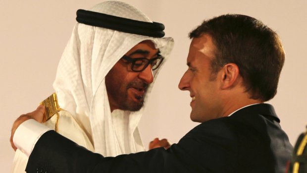 French President Emmanuel Macron is welcomed by the Crown Prince of Abu Dhabi Mohammed bin Zayed al-Nahayan to the Louvre Abu Dhabi Museum on Wednesday.