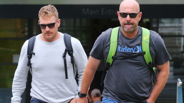 Australian coach Darren Lehmann leaves the hospital with Australian Twenty20 captain Aaron Finch.